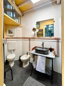 a bathroom with a sink and a toilet at Il Casale di Bubu in Modena +28 photos