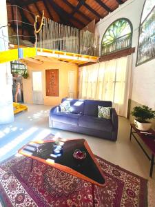 a living room with a couch and a table at Il Casale di Bubu in Modena