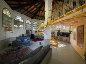 a large living room with a couch and a table at Il Casale di Bubu in Modena