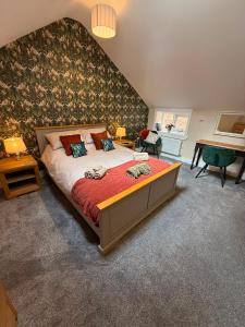 a bedroom with a large bed in a room at The Music Rooms in Bewdley