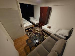 an overhead view of a living room with a couch and a table at Vila Melina Sarajevo in Bjelugovići