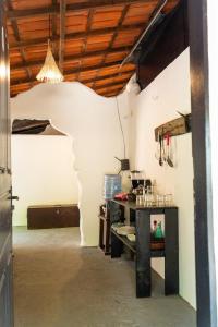 a room with a table and a ceiling at Alto Saudade - Atins in Barreirinhas