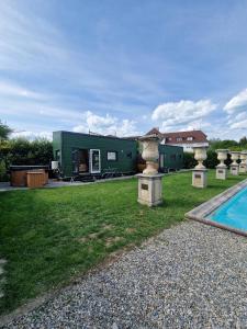 a house with a yard with a swimming pool at Little Luxe 2 in Amriswil