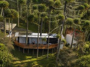 an aerial view of a house in the woods at Forte das Araucarias in Urubici