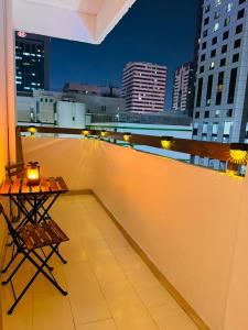 a table on the roof of a building at Majestic Inn in Abu Dhabi
