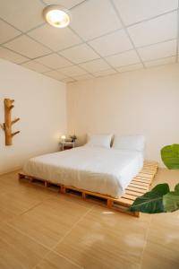 a bedroom with a large bed in a room at Always Boutique Stay 2 in Kampong Huaibū