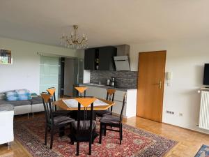 a dining room and kitchen with a table and chairs at Idyllisches Wohnen Weinberg in Bad Kissingen