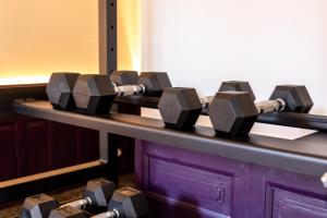 a row of dumbbells on top of a counter at Hôtel de Castigno - Wine Hotel & Resort in Assignan