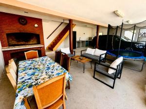 a living room with a table and chairs and a couch at Apartments & rooms Velebit in Lovinac