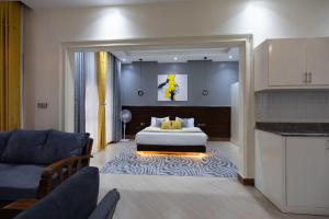 a hotel room with a bed and a living room at Pieme hotel residence 