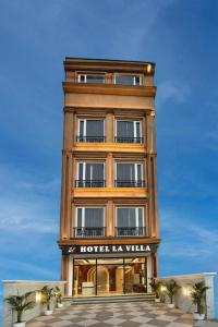 a hotel la villa building with a sign on it at HOTEL La VILLA in Amritsar