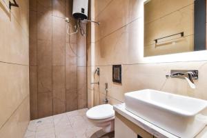 a bathroom with a sink and a toilet at HOTEL La VILLA in Amritsar
