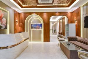 a dressing room with a couch and a table at HOTEL La VILLA in Amritsar