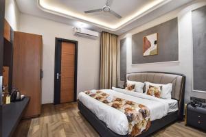a bedroom with a large bed in a room at HOTEL La VILLA in Amritsar +2 photos
