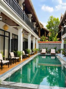 an image of a swimming pool in a house at Luang Prabang Indochine Heritage Hotel in Luang Prabang