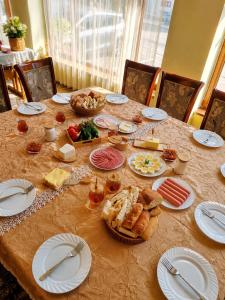 a table with plates and food on top of it at Syuzn Resort in Goris