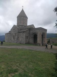 an old church with a cross on top of it at Syuzn Resort in Goris