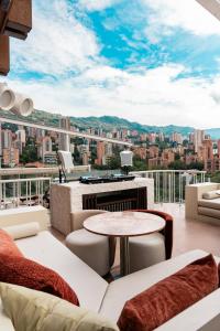 a living room with a view of a city at The Charlee Hotel in Medellín