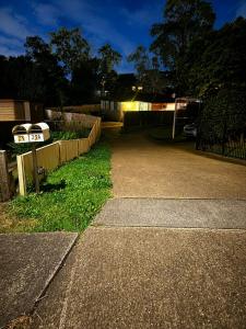 a parking lot with a fence and a driveway at 21A Armstrong Place in Schofields