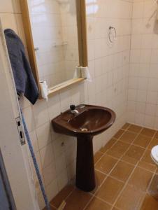 a bathroom with a sink and a mirror at Cabana Hostel Guarulhos - SELF CHECK IN in Guarulhos +22 photos