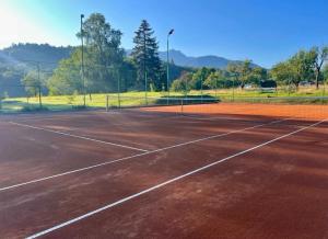 a tennis court with a net on top of it at Casa Braneana in Bran +262 photos