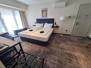 a hotel room with a bed and a living room at The 8 Hotel Budapest in Budapest