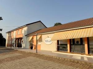 a row of shops on a street at Hôtel Montespan in Lussac-les-Châteaux