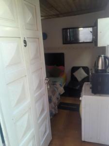 a door leading to a living room with a couch at Aires del Atlántico Sur in Burzaco +4 photos