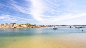 a man in a boat in a body of water at Ty Penty in Riantec