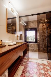 a bathroom with a sink and a shower at Quinta Linhas da Primavera in Guimarães +89 photos