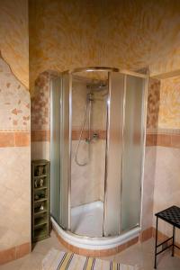 a bathroom with a shower in a room at Villa Concipat Rooms in Fonte Nuova