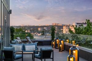 a balcony with chairs and lights on a building at Radisson Blu Leogrand Hotel in Chişinău