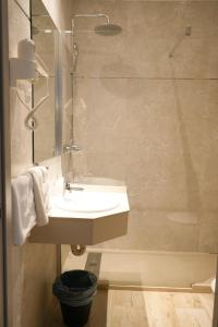 a bathroom with a sink and a shower at Hostal Guadiana in Ruidera +35 photos