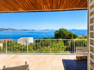 a balcony with a view of the ocean at Apartmani KaLu in Mlini