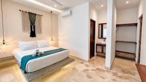 Kanté Hotel - Downtown Tulum में एक कमरे में एक या कई बेड