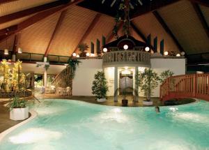 a large indoor swimming pool in a building at Fewo Penthaus-Blick in Willingen