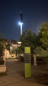 a tower with a light on top of it at night at شقة غرفة وصالة مريحة in Jeddah