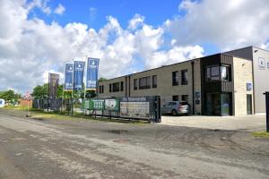 a building with a car parked in front of it at SmartStay in Gronau