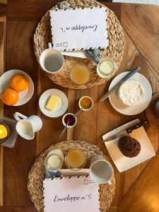 a table topped with plates and bowls of food at Domaine de Joreau in Gennes
