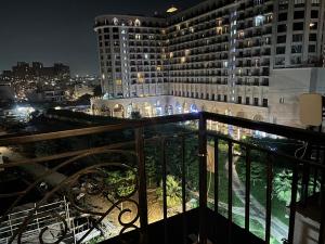 a view from a balcony of a building at night at The Novaire in Lucknow