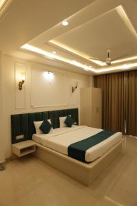 a bedroom with a large bed in a room at The Woods by CASA D' GAVA in Lucknow