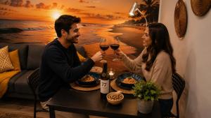 a man and woman sitting at a table with wine glasses at 77 Lisbon Design Apartment near Airport, Lisbon, Amadora, Odivelas & Sintra in Caneças
