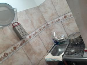 a bathroom with a sink and a counter top at Aires del Atlántico Sur in Burzaco