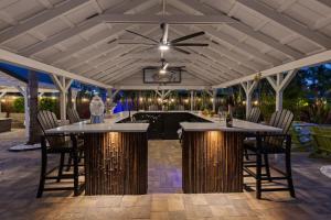 a patio with a pool table and chairs at Coconut Grove Resort in Clearwater Beach