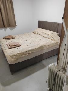 a bed sitting in a room with at Andrejić 1 in Veliko Gradište