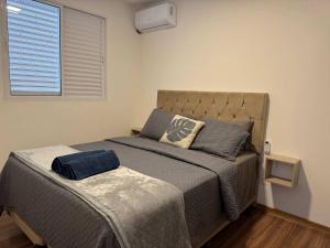 a bedroom with a bed and a window at Edifício Forte dos Lagos in Toledo +49 photos