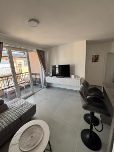 a living room with a couch and a table at Andrejić 1 in Veliko Gradište