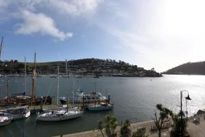 a group of boats docked in a harbor at Riverside 2 in Dartmouth