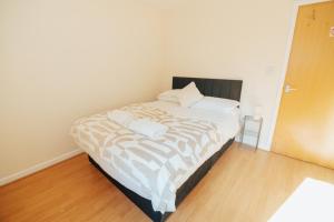 a bedroom with a bed with two pillows on it at The Welsh Hideaway in Llanberis