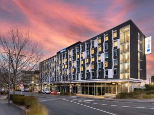 a rendering of a building on a street at ibis Budget Auckland Airport in Auckland